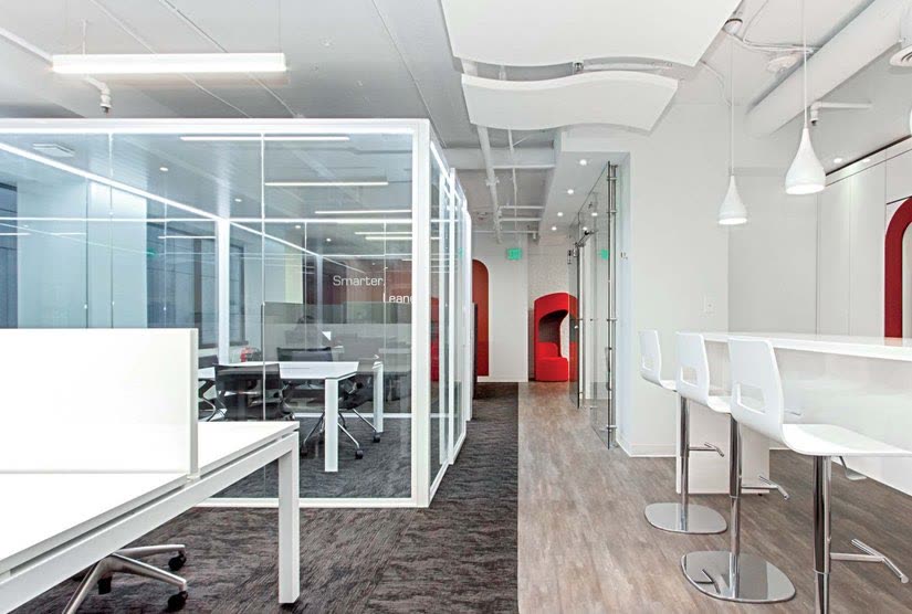 Freestanding glazed pod standing on an open-plan office floor