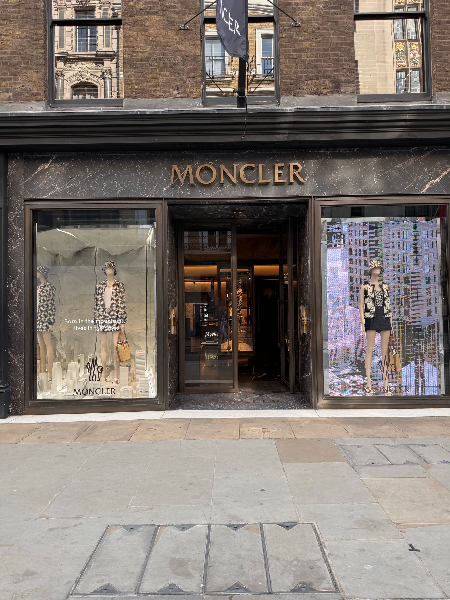 Moncler shopfront in stone and bronze on a London street
