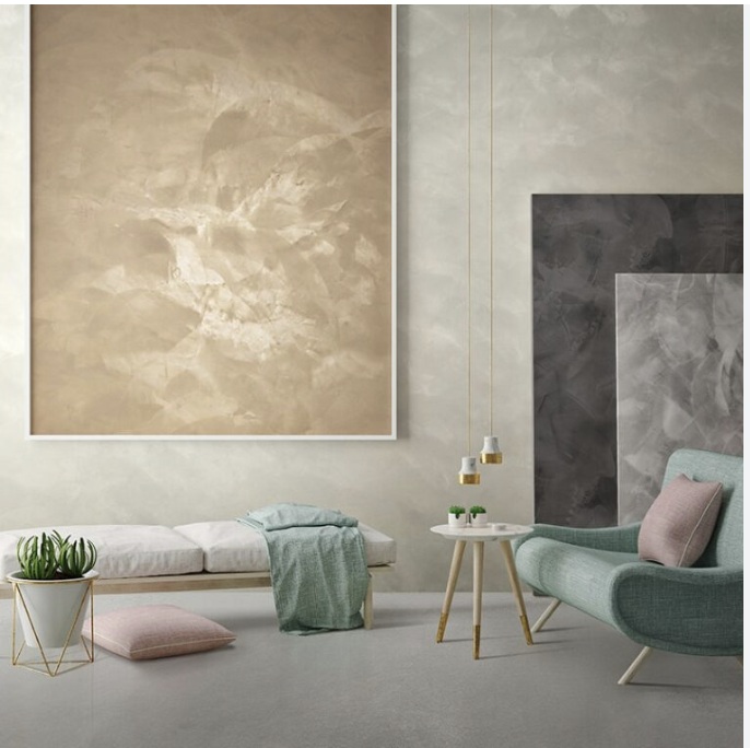 Living room with pale stone-coloured walls and floor, and framed panels of the same finish in sand and greys