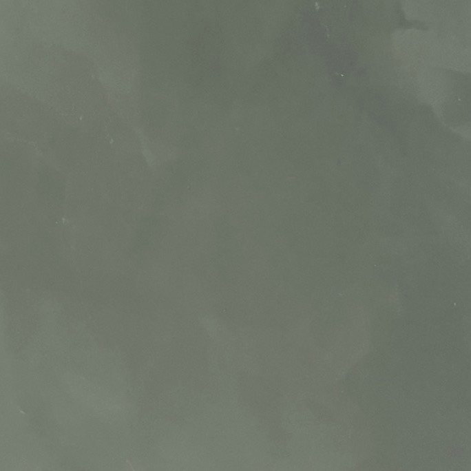Close-up of a deeper olive green resin sample board, evenly coloured