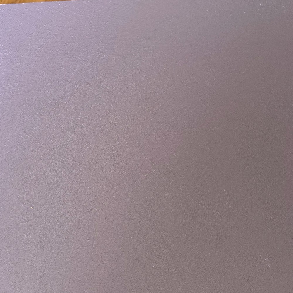 Close-up of a soft mauve resin sample board with a gentle sheen